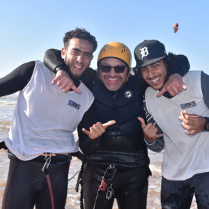 Happy picture of a Bleukite student with 2 teachers Essaouira Morocco